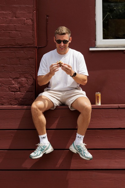 A customer eating outside the Junto cafe — photo 237
