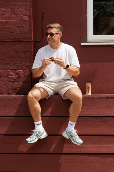 A customer eating outside the Junto cafe — photo 238