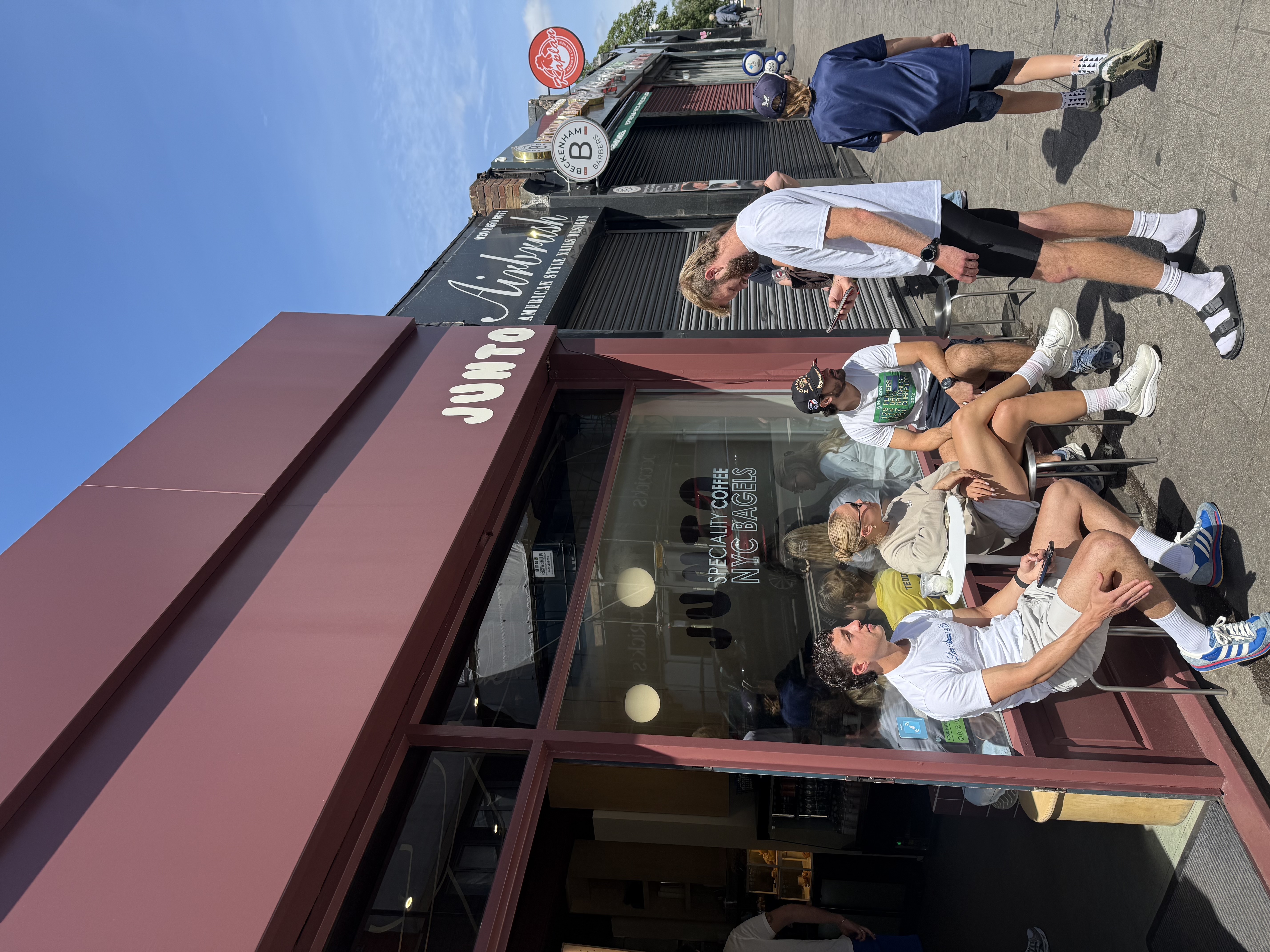 Customers at the window bar on a sunny day.